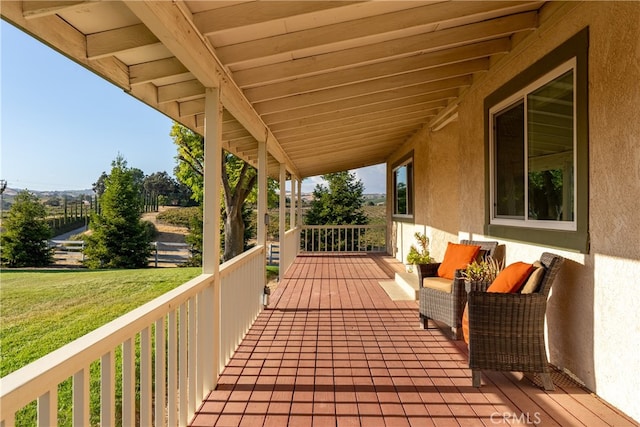 wooden deck with a yard