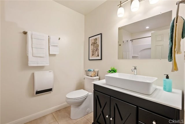 full bathroom with baseboards, a shower with curtain, toilet, vanity, and tile patterned floors