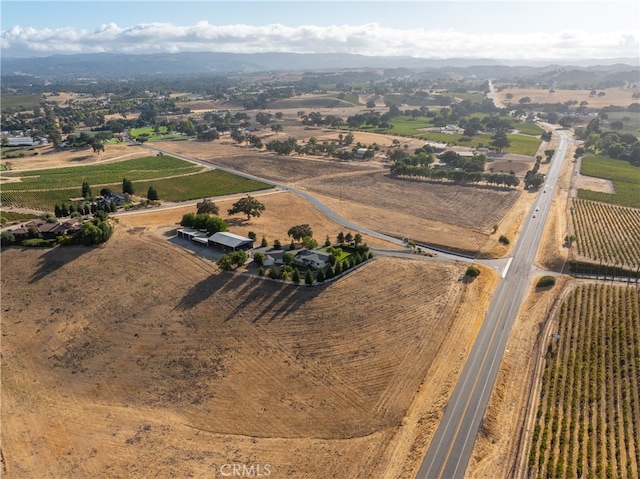 birds eye view of property with a rural view