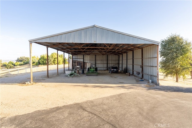 view of parking / parking lot with a carport