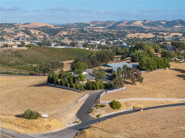 drone / aerial view with a mountain view and a rural view