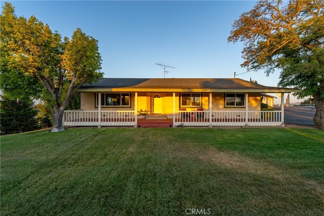 view of front of property with a front lawn and a porch