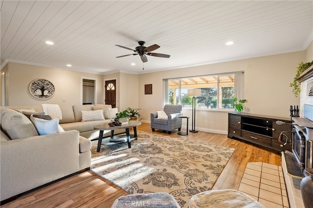 living room with wood ceiling, light hardwood / wood-style floors, ornamental molding, and ceiling fan