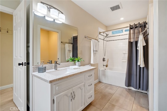 bathroom with vanity, tile patterned floors, and shower / tub combo with curtain