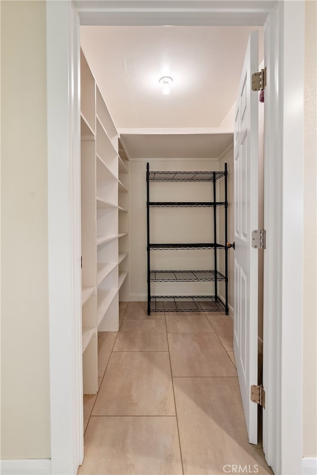 walk in closet featuring light tile patterned floors