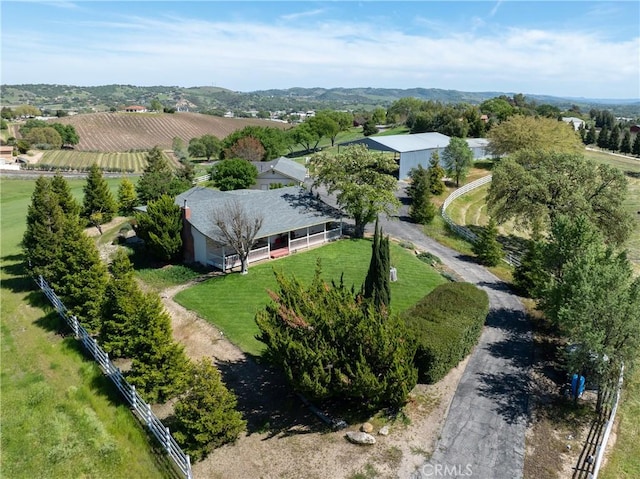 birds eye view of property with a rural view