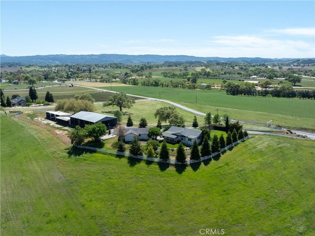 birds eye view of property with a rural view and a mountain view