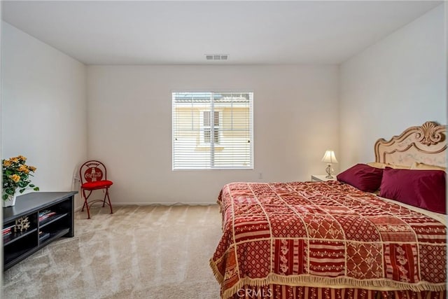 bedroom with light colored carpet