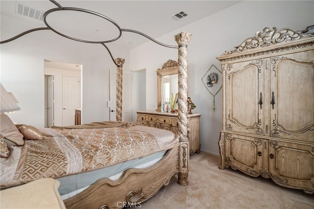 bedroom featuring light colored carpet