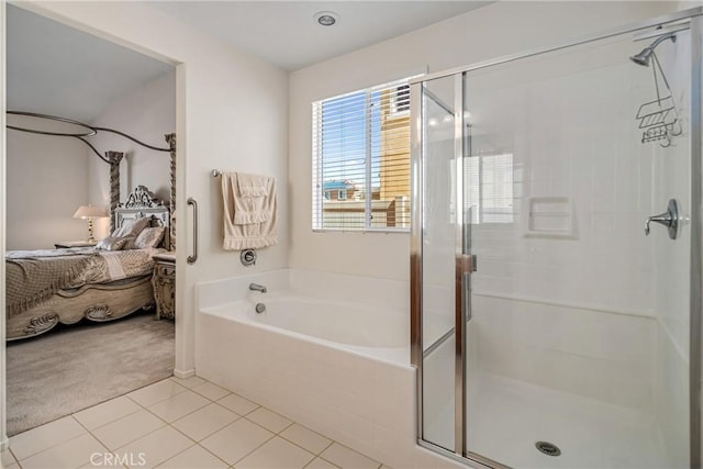 bathroom with tile patterned floors and separate shower and tub