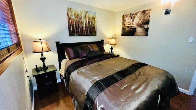 bedroom featuring dark hardwood / wood-style floors