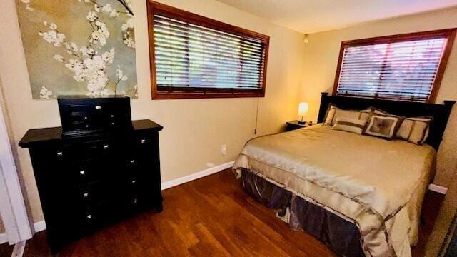 bedroom featuring dark wood-type flooring