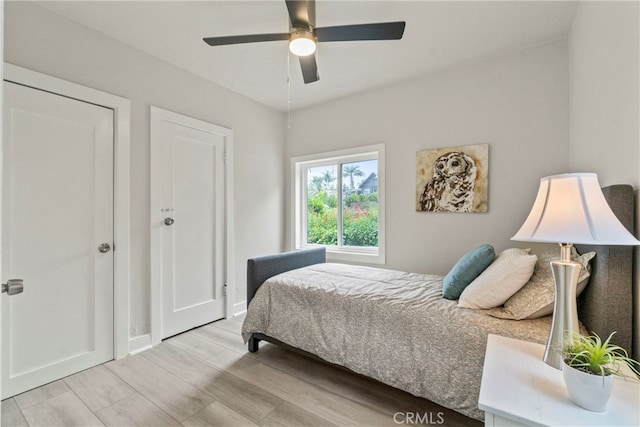 bedroom featuring ceiling fan and light hardwood / wood-style floors