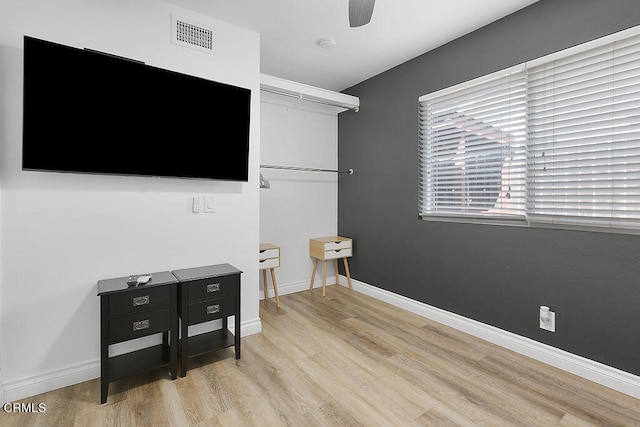 bedroom with ceiling fan and light hardwood / wood-style floors