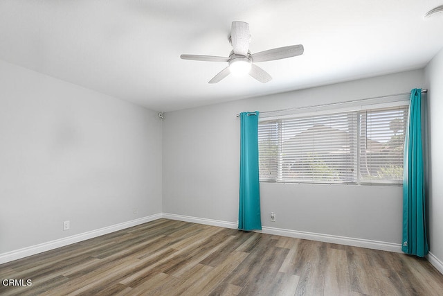 unfurnished room featuring ceiling fan and hardwood / wood-style floors