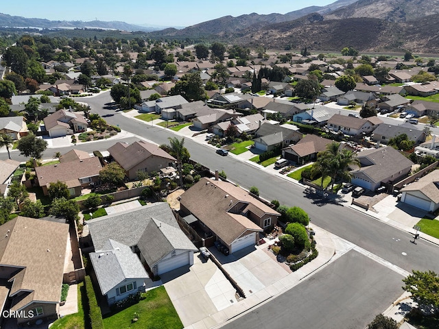 birds eye view of property with a mountain view