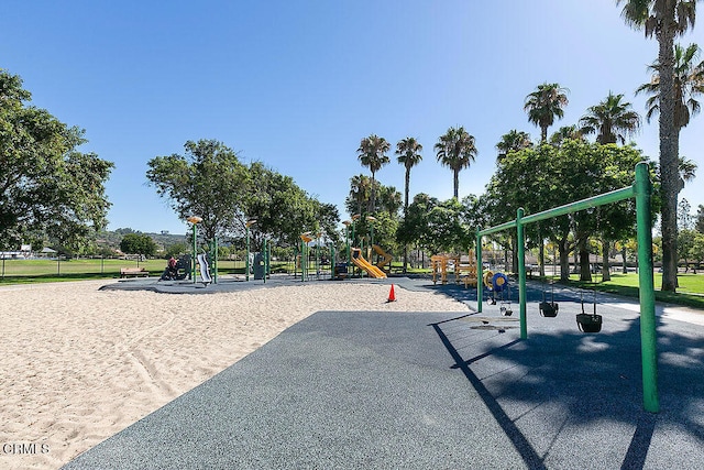 view of property's community with a playground