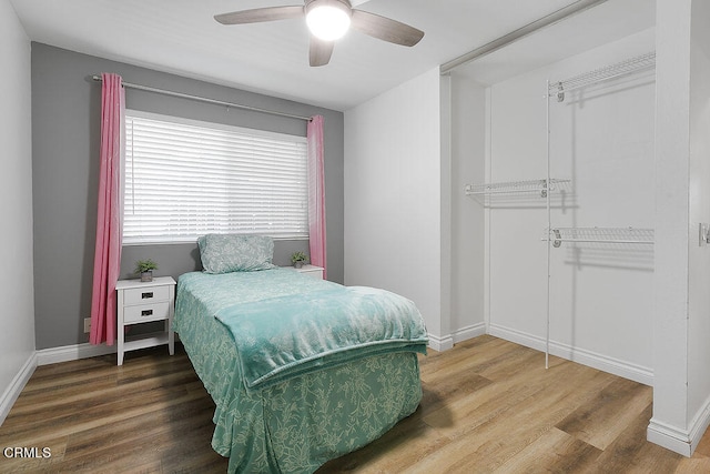 bedroom featuring wood-type flooring and ceiling fan