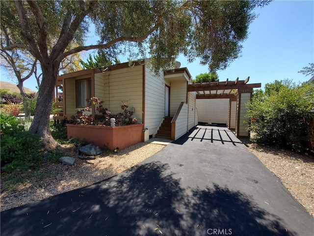 view of front of house with a pergola