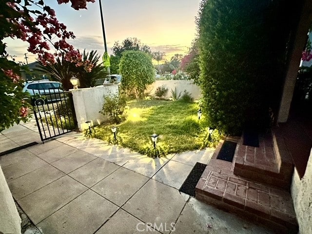 view of patio terrace at dusk