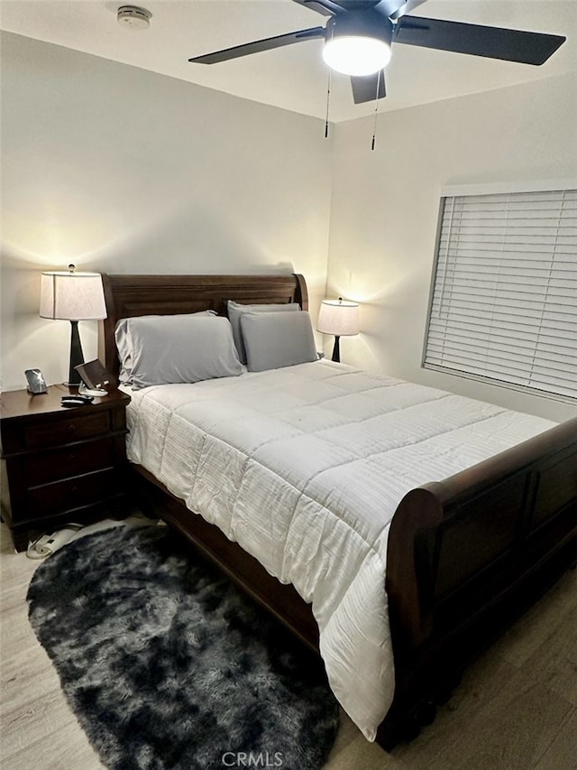 bedroom featuring ceiling fan and hardwood / wood-style floors