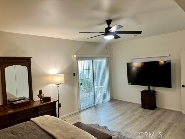 bedroom featuring light wood-type flooring, ceiling fan, and access to exterior