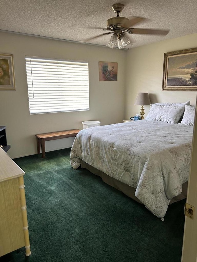 carpeted bedroom featuring ceiling fan and a textured ceiling