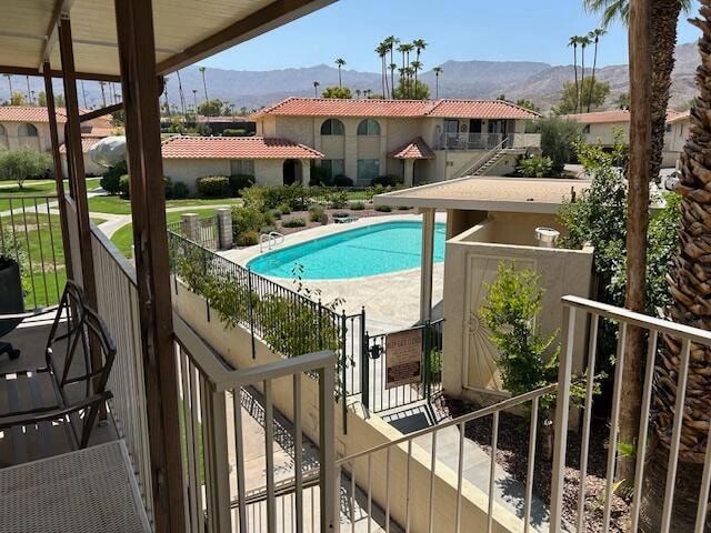 view of pool with a mountain view