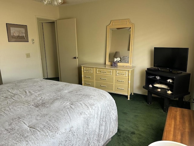 bedroom featuring dark carpet