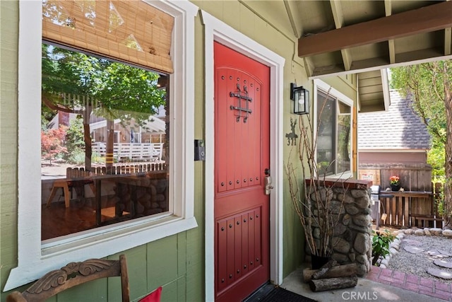 doorway to property featuring a porch