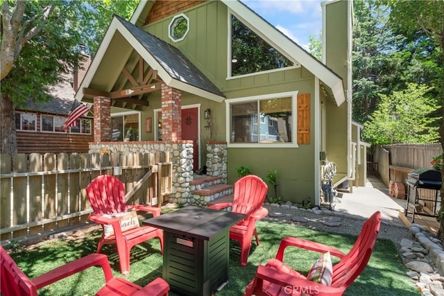 rear view of property featuring a patio area