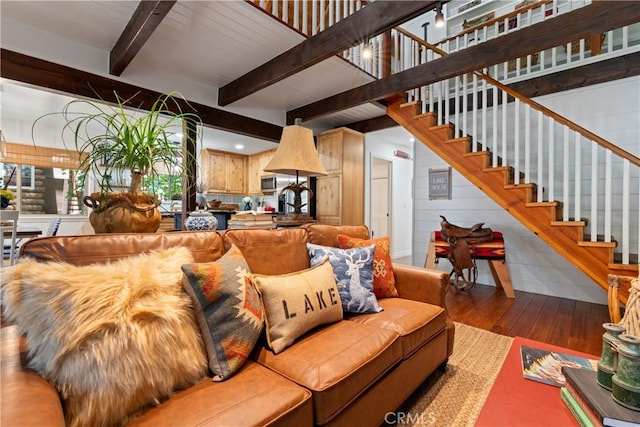 living room with wood-type flooring and beamed ceiling