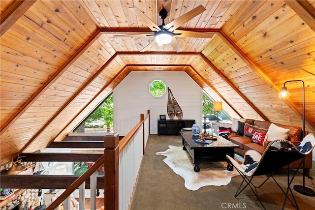 additional living space featuring carpet floors, ceiling fan, lofted ceiling with beams, wooden walls, and wood ceiling