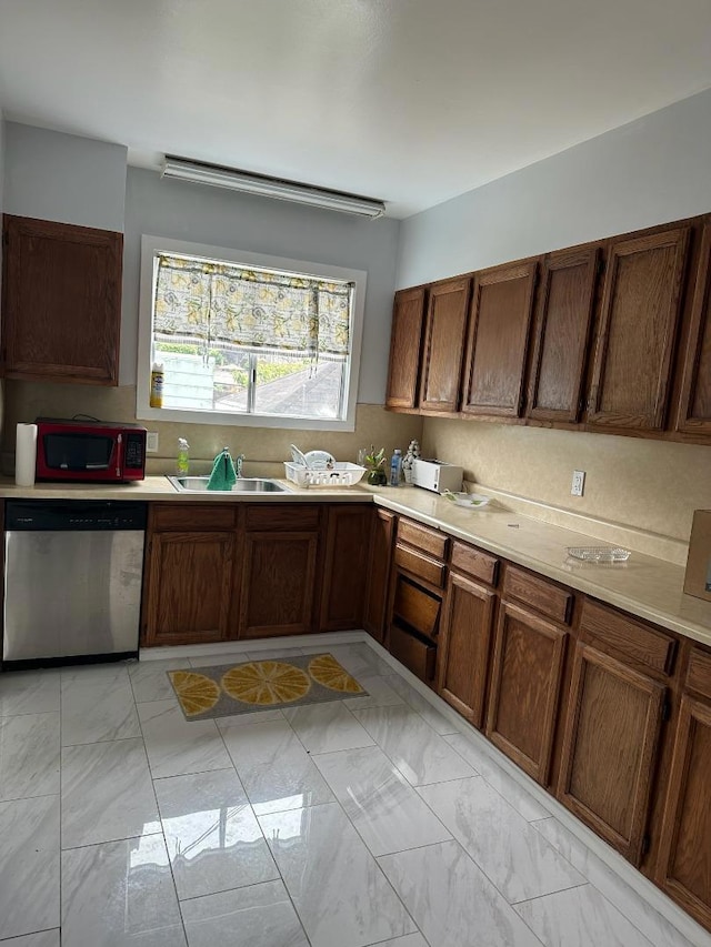 kitchen with sink and stainless steel dishwasher