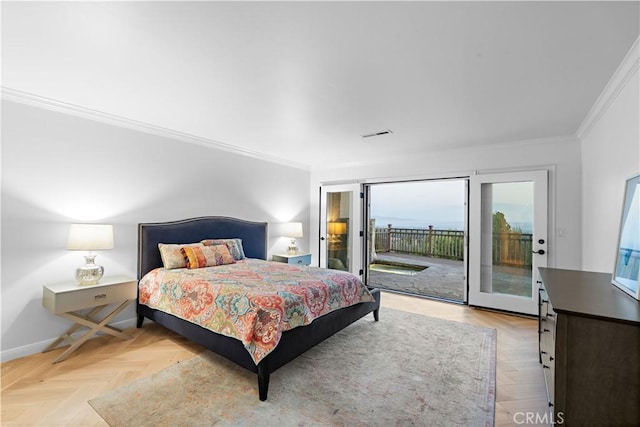 bedroom featuring ornamental molding, light parquet floors, and access to outside