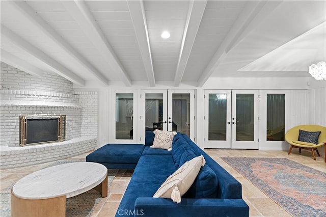 living room featuring french doors, beam ceiling, and a brick fireplace