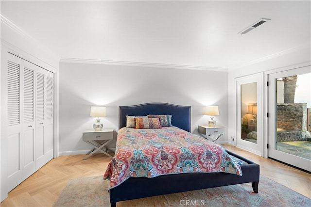 bedroom with a closet, visible vents, ornamental molding, access to outside, and baseboards