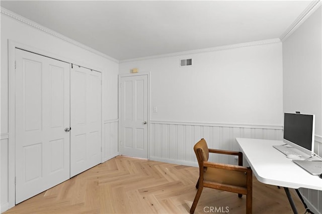 office area with visible vents, ornamental molding, and wainscoting