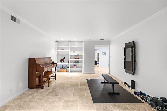 workout room featuring stone finish flooring, ornamental molding, visible vents, and baseboards