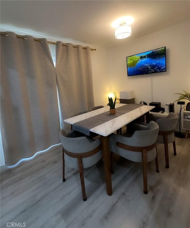 dining area featuring hardwood / wood-style flooring