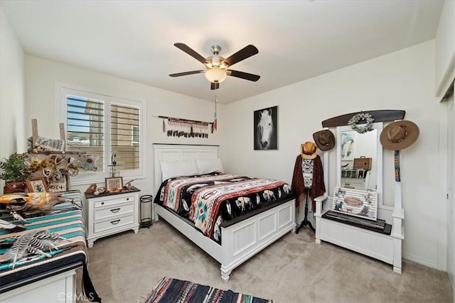 bedroom with light colored carpet and ceiling fan