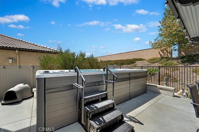 view of patio with a hot tub