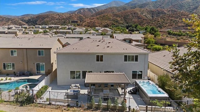 rear view of house with a mountain view