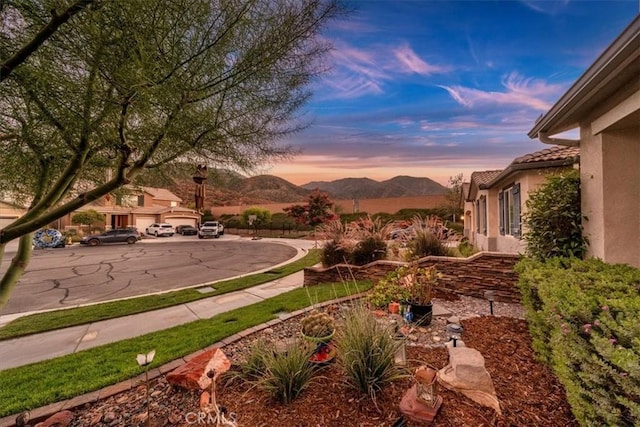 yard at dusk with a mountain view