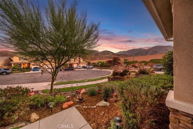 yard at dusk with a mountain view