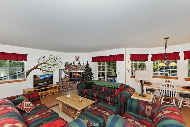 living room with hardwood / wood-style flooring and a healthy amount of sunlight