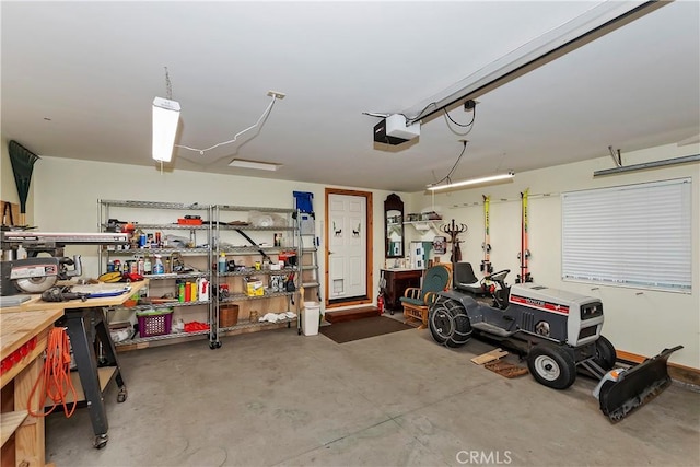 garage featuring a workshop area and a garage door opener