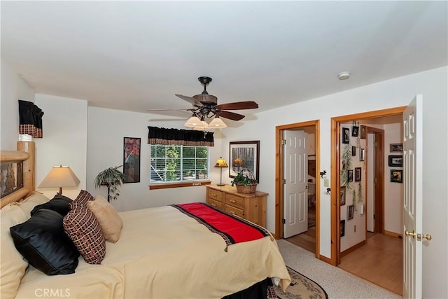 bedroom featuring ceiling fan and light wood-type flooring