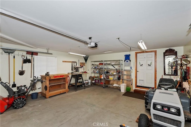 garage featuring a workshop area and a garage door opener