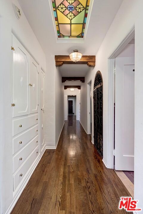 hallway featuring dark hardwood / wood-style flooring